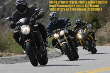 Mobs of motorcycle-riding armed militia hunt Venezuelan streets for Trump suppor